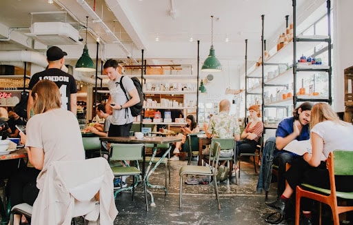 diners sitting and ordering in restaurant